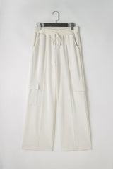 Pantalones de cintura alta con cordón y bolsillos