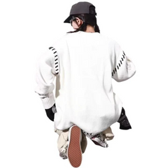 Suéter torcido con letras bordadas de High Street