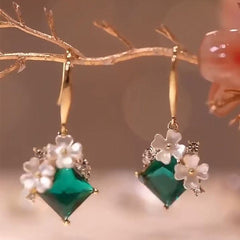 Pendientes colgantes con diseño floral de color verde esmeralda