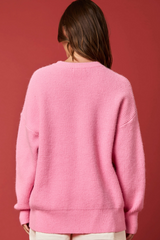 Suéter de punto con bastón de caramelo y feliz Navidad