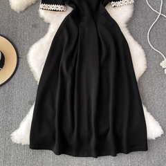 Retro kurzärmliges Rundhals-A-Linien-Kleid in mittlerer Länge