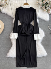 Ausgestelltes, langärmliges, figurbetontes Kleid mit Stehkragen