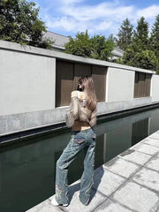 Pantalones de pierna recta viejos con bordado con flecos retro adelgazantes únicos y sexys para niñas de 2024