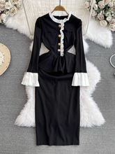 Ausgestelltes, langärmliges, figurbetontes Kleid mit Stehkragen