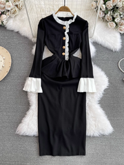 Ausgestelltes, langärmliges, figurbetontes Kleid mit Stehkragen