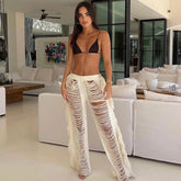 Pantalones deshilachados de punto desgastado