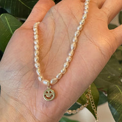 Natural pearl choker with charm