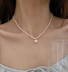 Natural pearl choker with charm