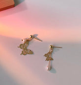 Pendientes llamativos de mariposa con encaje dorado