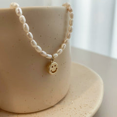 Natural pearl choker with charm