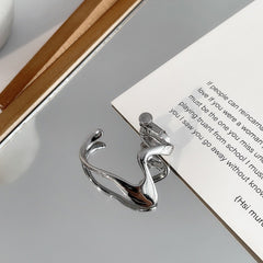 Puño de oreja en forma de hélice