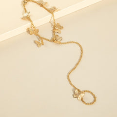 Cadena de mano con mariposa dorada