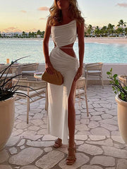 Vestido largo con abertura y calado en color liso