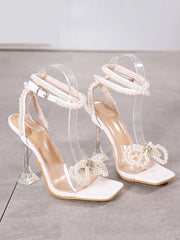 Sandalen mit hohem Absatz und Perlenschleife
