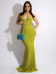 Vestido ajustado con escote en V profundo, espalda descubierta y lazo