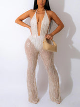 Mono con escote en V y lentejuelas y borlas