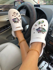 Pantoletten mit Strasssteinen und bösen Augen