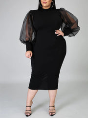 Vestido midi con mangas farol y abertura en la costura