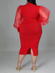 Vestido midi con mangas farol y abertura en la costura