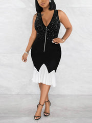 Kleid mit Strasssteinen und Rüschensaum