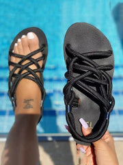 Sandalias planas con cordones cruzados