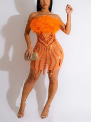 Wickelkleid aus Netzstoff mit Federpailletten