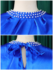 Vestido con volantes y mangas vendadas con cuello de perlas