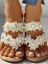 Sandalias planas con perlas y flores