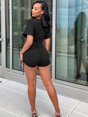 Mono corto con escote en V y mangas dolman