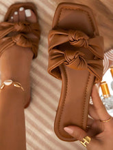 Zapatillas planas con lazo doble