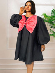 Vestido midi con bloques de color y lazo