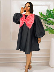 Vestido midi con bloques de color y lazo