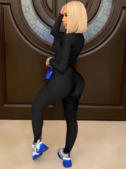 Mono ajustado con escote en V y cremallera delantera