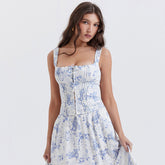 Top sin mangas con escote cuadrado, volantes y lazo en la parte delantera con estampado floral - Azul