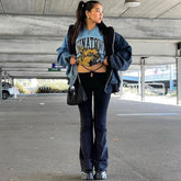 Skinny-Hose mit weitem Bein und Cut-Out - Schwarz