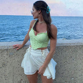 Top tipo corsé con botones y borde con volantes - Verde