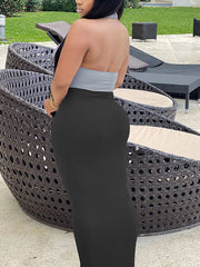 Vestido largo ajustado con espalda descubierta y huecos