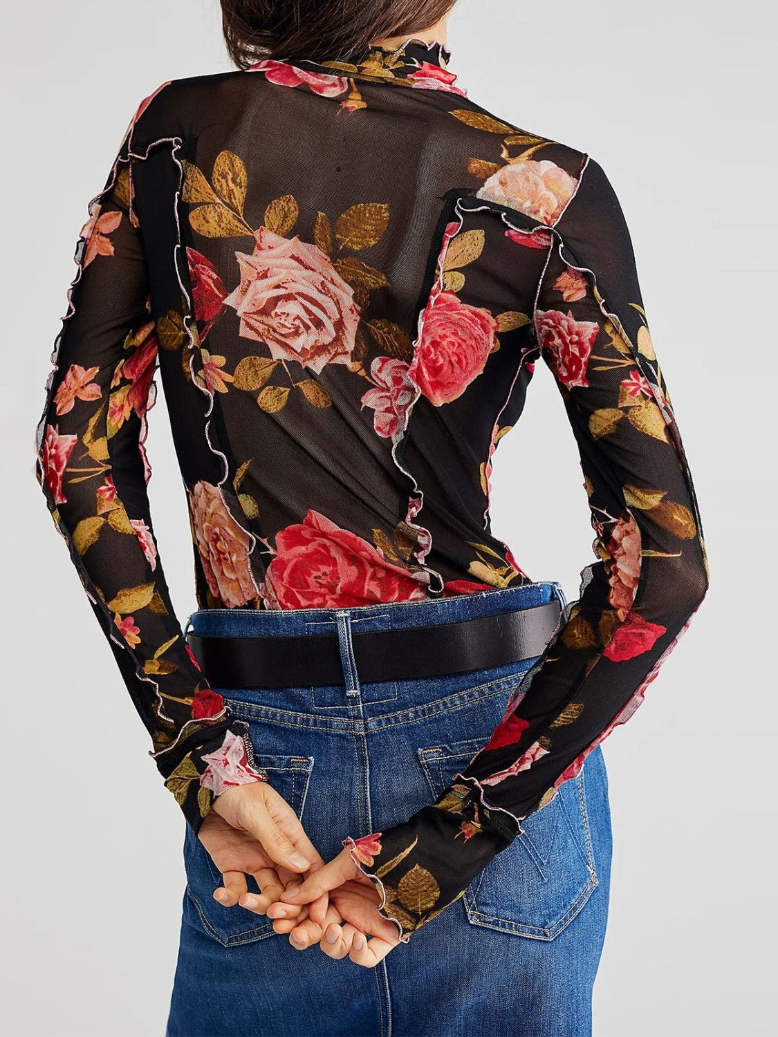 Blusa de manga larga con cuello alto y estampado floral