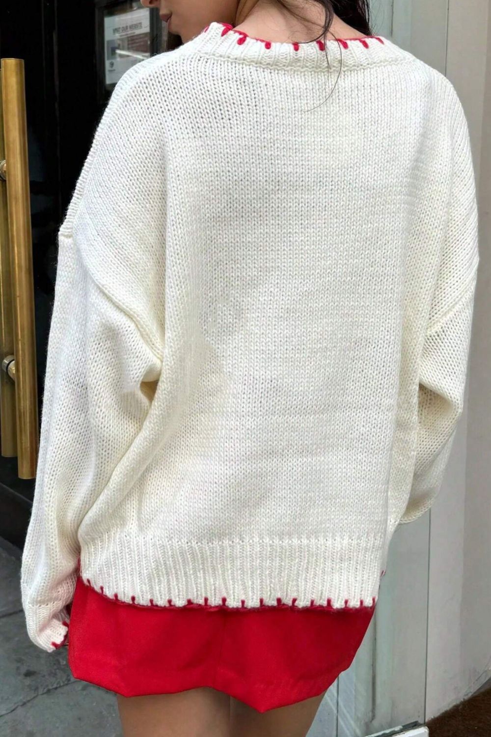 Suéter de manga larga con cuello redondo y estampado de lazo