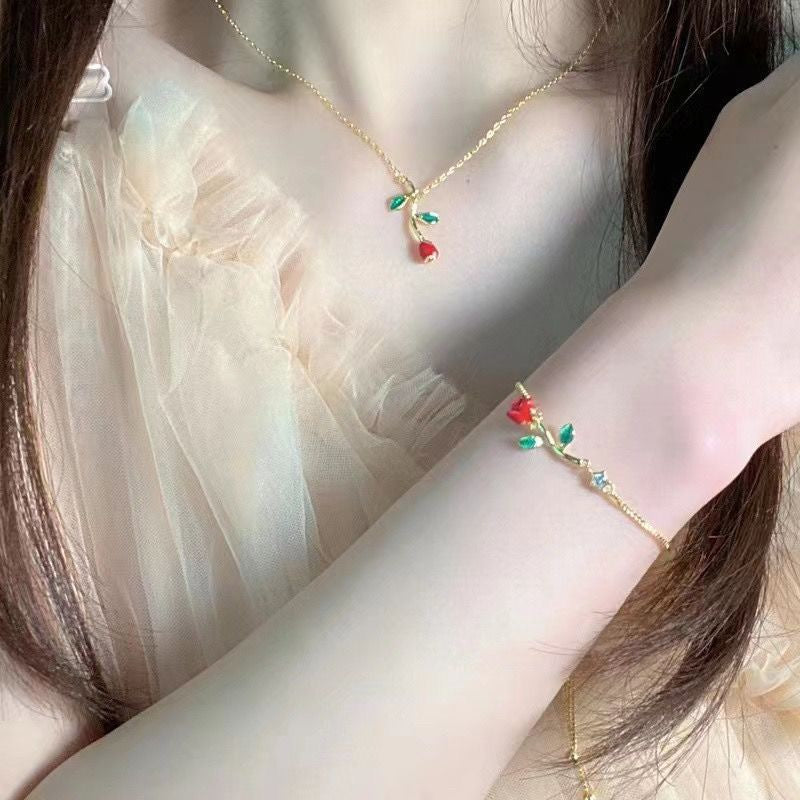 Conjunto de collar y pulsera con rosas rojas románticas