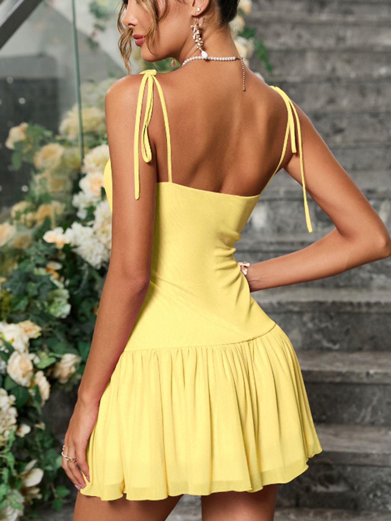 A Sleeveless Pleated And Cinched Short Dress