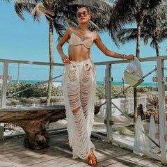 Pantalones deshilachados de punto desgastado