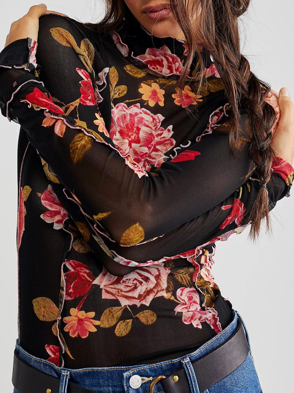 Blusa de manga larga con cuello alto y estampado floral