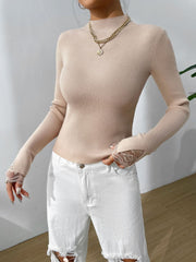 Suéter de manga larga con cuello alto y detalle de encaje