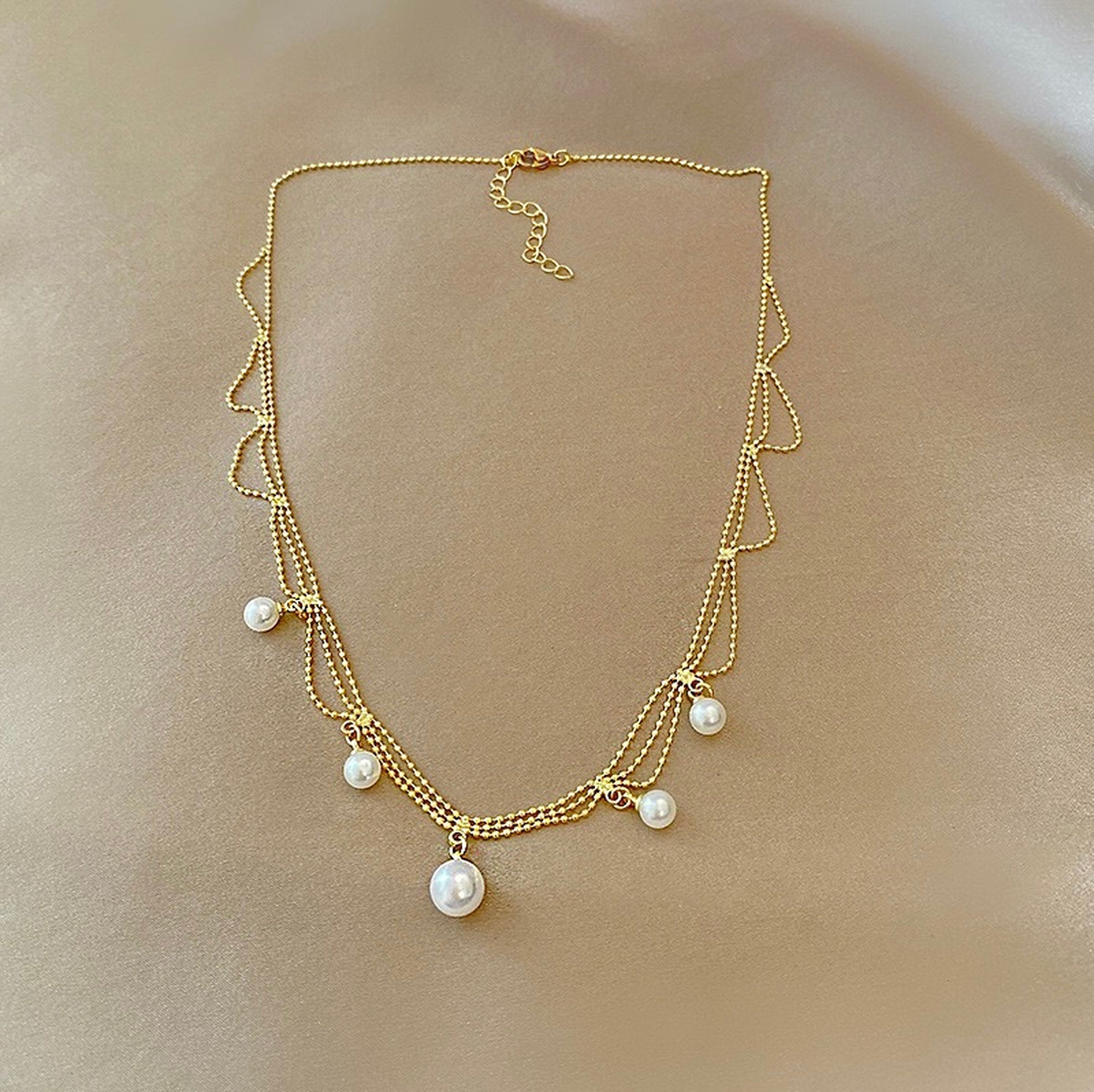 Multi layer gold pearl necklace