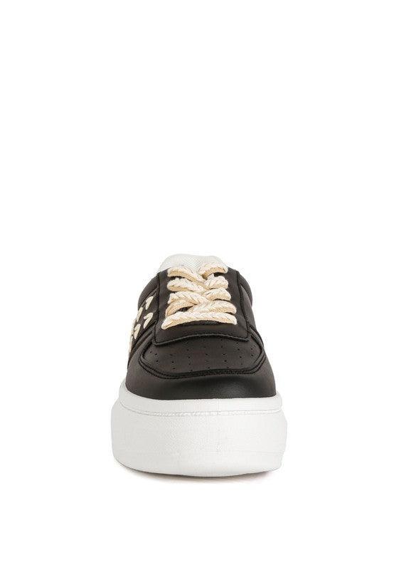 Zapatillas Monigue de piel sintética con detalle de punto de cruz