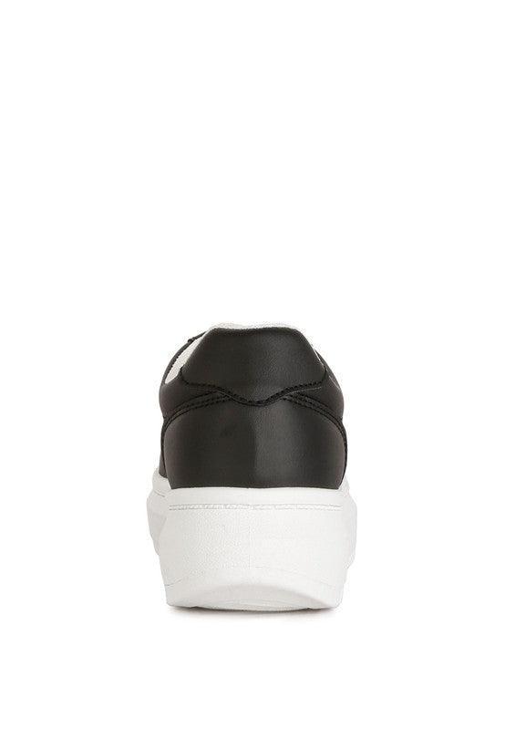 Zapatillas Monigue de piel sintética con detalle de punto de cruz