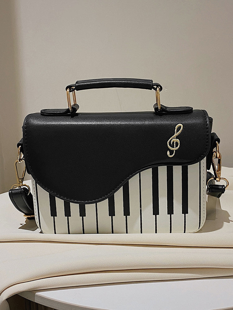 Bolsa bordada con estampado de música de piano