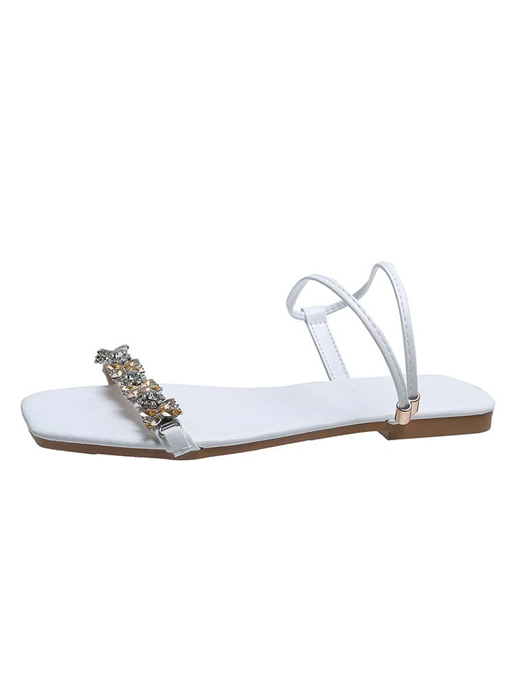 Flache Sandalen mit Strasssteinen